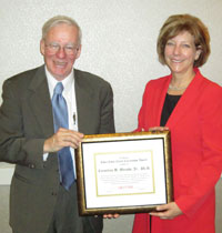 Cornelius B. Murphy, Jr., Ph.D. (left) receives the CNY&nbsp;RPDB's Rhea Eckel Clark Citizenship Award from Board Chairwoman Kathleen A. Rapp at the Board's 2013 Annual Meeting