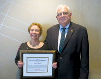 Rhea Jezer (left) receives the CNY&nbsp;RPDB's Rhea Eckel Clark Citizenship Award from Board Chairman James J. Murphy, Jr., at the Board's 2017 Annual Meeting